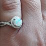 A beautiful 925 silver ring with a white lab opal surrounded by shining cubic zirconia. Image 3