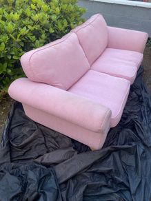 Large pink 2 seater sofa also large purple foot stool