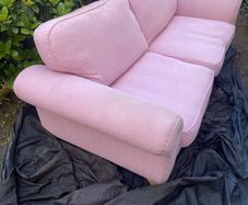 Large pink 2 seater sofa also large purple foot stool