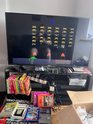 Atari 2600 Space Invaders Woody Atari 2600 with 15 individual games and 14 game Indy 500 driving
