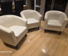 Three stylish leather arm chairs. Two require upholstery