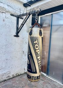 Boxing bag with wall bracket