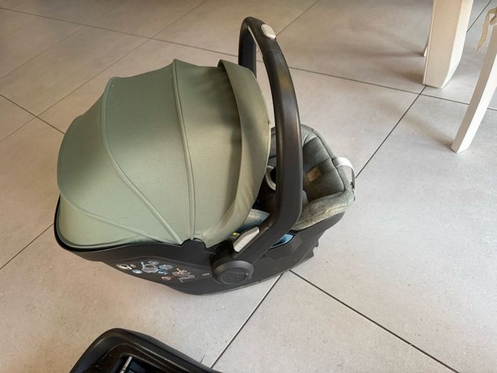 This is an UPPAbaby Mesa i-Size Infant Car Seat in a green-toned fabric.