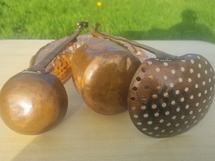 Vintage-style copper cookware and kitchen accessories.