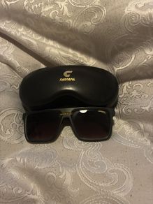 Carrera sunglasses and a protective case.