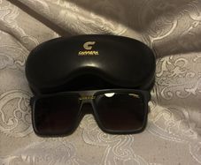 Carrera sunglasses and a protective case.