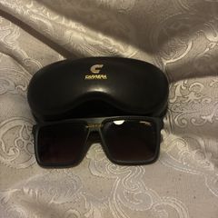 Carrera sunglasses and a protective case.