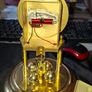 West Germany Estyma Anniversary Clock, featuring a brass finish and a rotating pendulum under a Glass Dome, Image 5