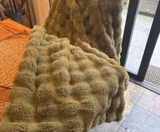 Faux fur green throw with velvet back