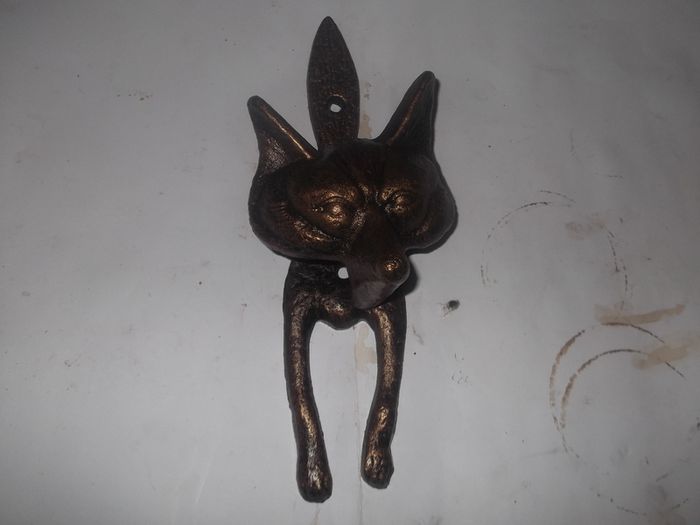 a metal fox door knocker