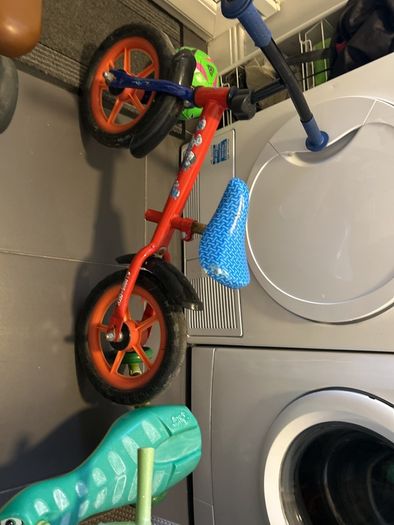 Two toddler bikes and a balance bike