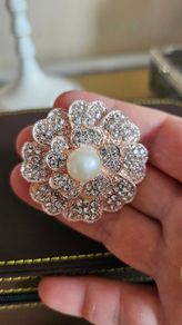 Flower with pearl brooch