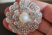 Flower with pearl brooch