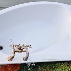 White Corner Bath with Traditional Brass Taps