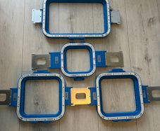 Magnetic hooping station and hoops