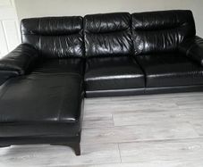 Black L shaped Leather Couch