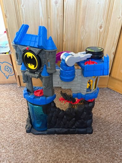 Batmans batcave with Batman and bike.
