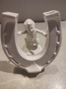 Rare find Cherub  Porcelain Horseshoe as flower vase held with child .