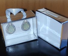 New pack of earrings, silver tone with light green insert
