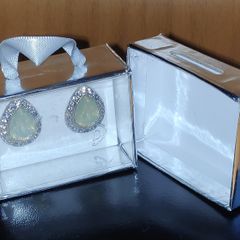 New pack of earrings, silver tone with light green insert