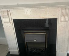 Marble fire place and electric fire