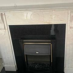 Marble fire place and electric fire