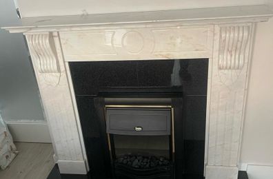 Marble fire place and electric fire