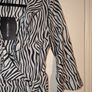 Perfect for Summer. black Zebra Print Wrap Tea Dress from Pretty Little Thing Image 4