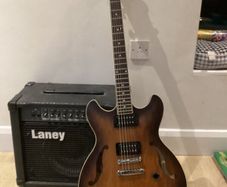 As new Ibanez AS53-TF electric guitar + amp.