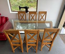 Glass dining room table with 6 chairs