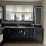 Black high gloss kitchen units and countertop Image 3