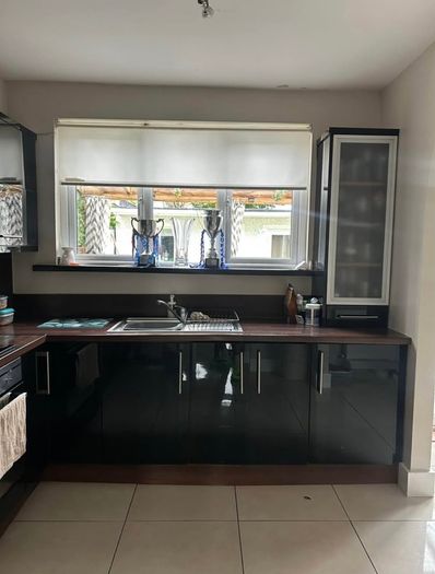 Black high gloss kitchen units and countertop