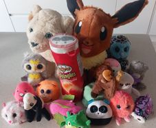 Large collection of assorted soft toys and plushies