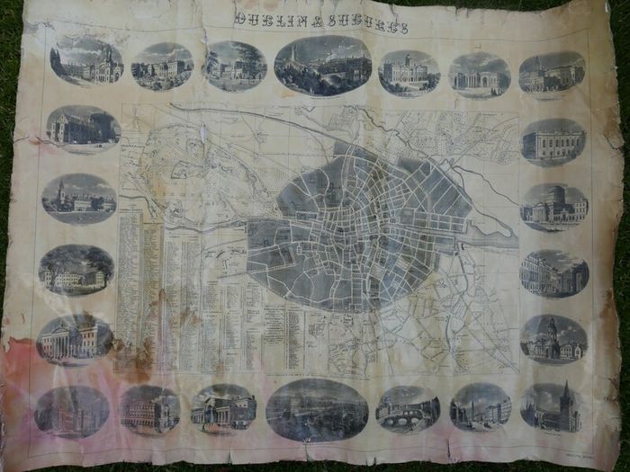 Antique DUBLIN. Map of Dublin & Suburbs with 22 vignettes of Dublin landmarks. Published by Edward Heffernan, 1st June, 1868, 12 Charleville Road, Rathmines. 28" x 22,5". Linen backed. Frayed at edges
