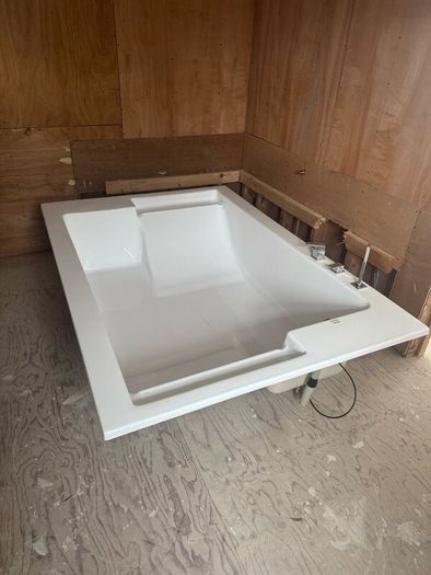 Brand new two person bath with fittings