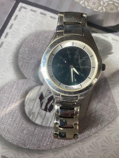 Relic face changing watch with broken watchstrap