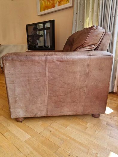 brown leather sofa and arm chair