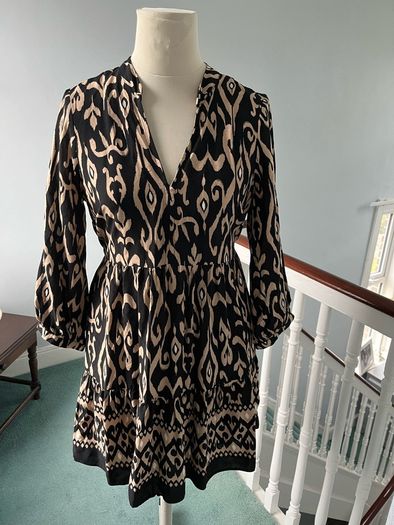 Brand new black and beige long sleeved mini dress