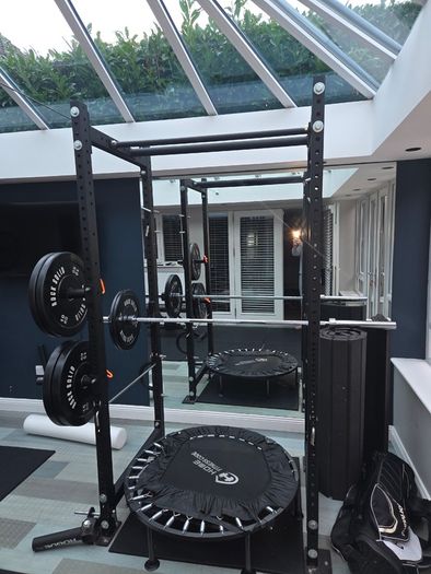 Mint condition - amazing heavy duty black squat rack with almost brand new Rock Solid barbell and bumper plates - a must see!!!