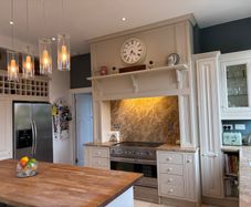 Kitchen cabinets, island and marble