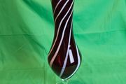 Elegant Murano-style vase made of art glass in ruby red with white spiral stripes