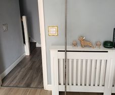 long curtain pole with bits marks in the metal