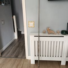 long curtain pole with bits marks in the metal