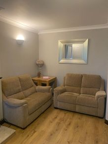 Pair of Parker Knoll 2 seater sofas with matching footstool