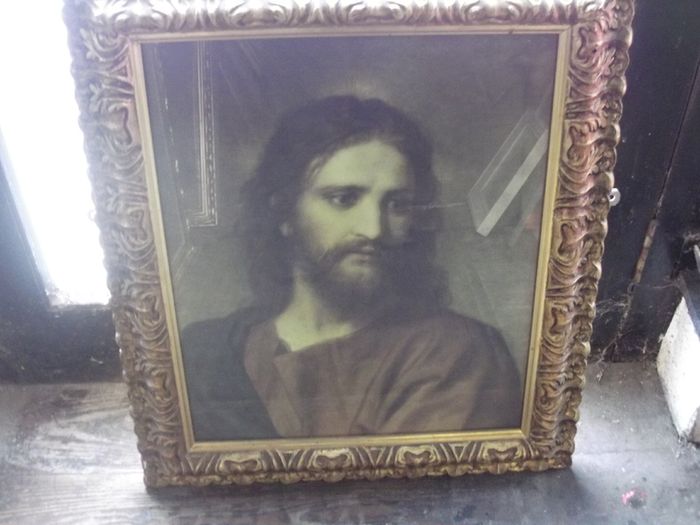 a large vintage holy picture in a lovely gild  frame