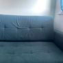 Grey fabric sofa bed with large storage compartment. Image 5