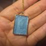 White Butterfly Necklace in Blue Background and Golden Frame Image 2