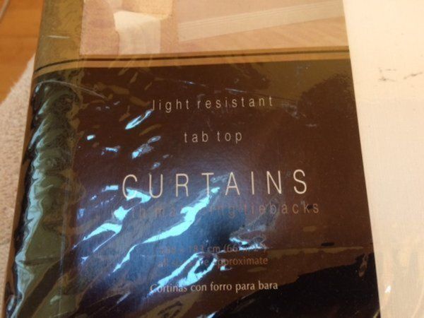 Tab top.Light resistant ivory curtains.168 x 183cm
