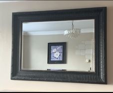 Black rectangle mirror with gold stud detail