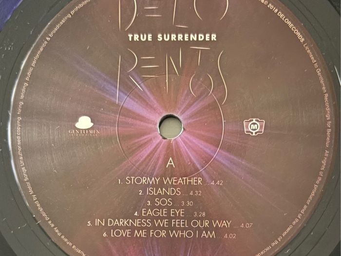 Delorentos - True Surrender. Printed inner sleeve. Played once. Like new except for a short and very minor seam split that's barely visible on photos. Bargain!